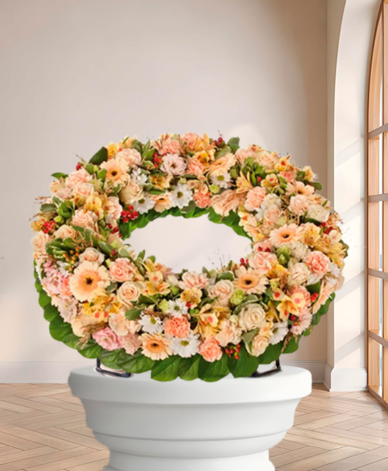 Couronne Tradition — fleurs de deuil livrees a Paris